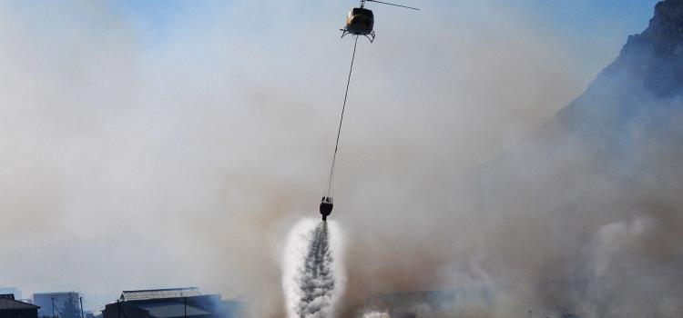 A helicopter undertaking aerial suppression